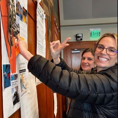 Agency staff creating posters at our second annual staff retreat